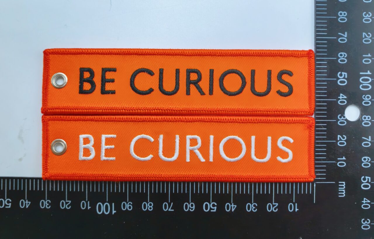 Nouvelle flamme porte clés lokan "be curious"